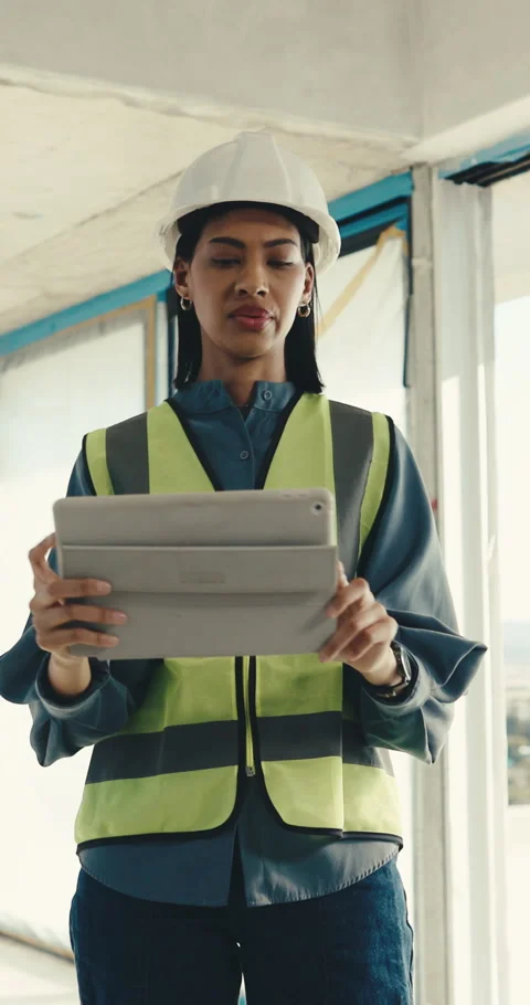 Engineer, tablet and woman at construction site with photography, inspection or Stock Footage 345581999