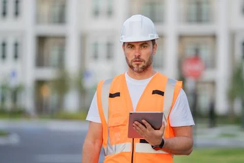 Engineer with tablet, building inspection. Builder at building site 스톡 사진