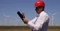 Engineer Taking Notes Clipboard Wind Turbine Farm Looking Man Work Power Plant 4k or 4k+ Resolution