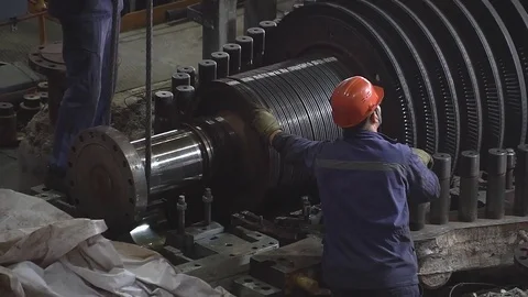 Engineer taking notes for maintenance steam turbine of thermal power plant Видео 83801016