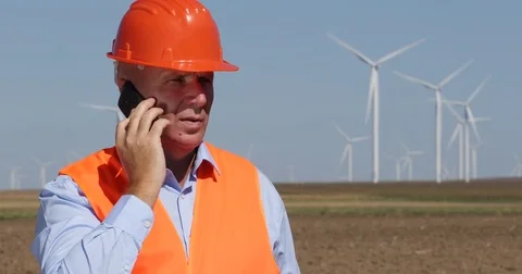 Engineer Talk Mobile Phone Technical Teamwork Wind Turbines Energy Generators Stock Footage 83661195