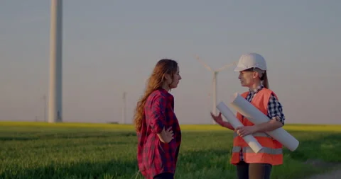 Engineer talking with farmer at Field Agriculture Windmill Farm Turbine Stock Footage 204050701