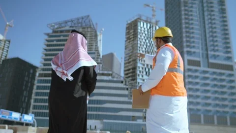 An Engineer talking front of King Abdullah Economic City in Riyadh, Saudi Stock Footage 113441452