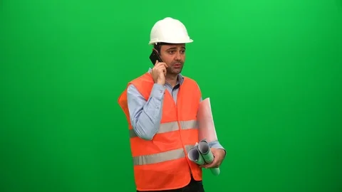 Engineer Talking on Phone and Hold in Hand Blueprint Papers Stock Footage 88652718