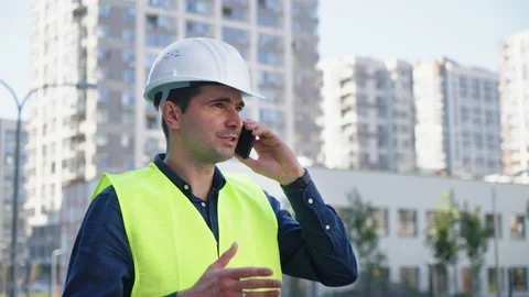 Engineer talking on phone at construction site Stock Footage 160805028