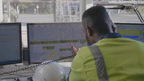 Engineer talking on phone in control room Stock Footage 114349109