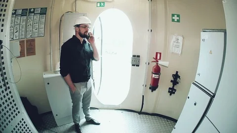 Engineer talking on the phone Stock Footage 73469401