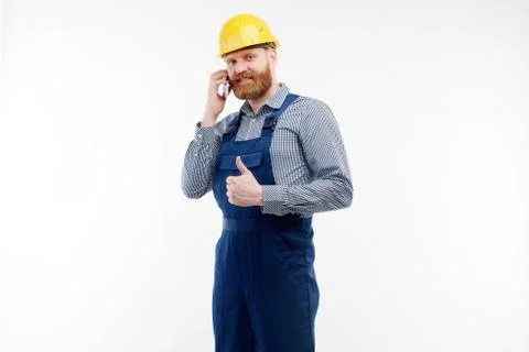 Engineer talking on the phone on a white background Stock Photos