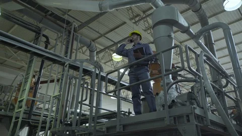 Engineer talking on smart phone Stock Footage 106322169