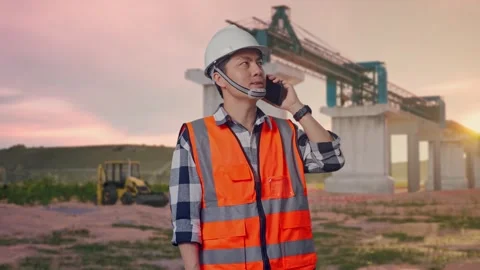 Engineer Talking On Smartphone at Construction Site Stock Footage 330330672