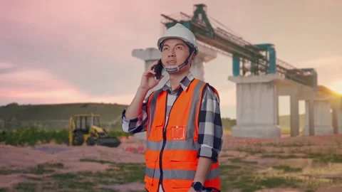 Engineer Talking On Smartphone at Construction Site Stock Footage 330330786