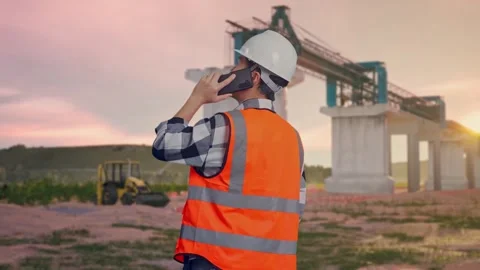 Engineer Talking On Smartphone at Construction Site Stock Footage 330330892