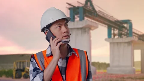 Engineer Talking On Smartphone at Construction Site Stock Footage 330331195