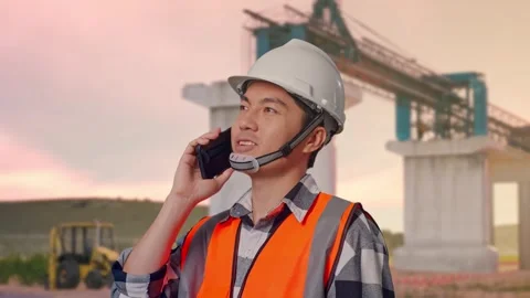 Engineer Talking On Smartphone at Construction Site Stock Footage 330331721