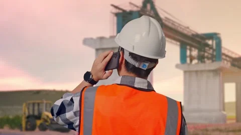 Engineer Talking On Smartphone at Construction Site Stock Footage 330331797