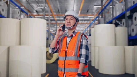 Engineer Talking On Smartphone at Polymer Plant Stock Footage 334524996