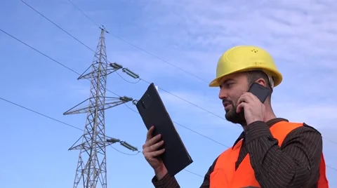 Engineer talking with team about power shortage identify electrical poll problem Stock Footage 58513708