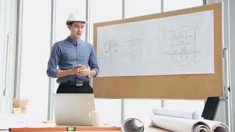 Engineer talks about production growth have conference video call via compute Stock Footage 171257792