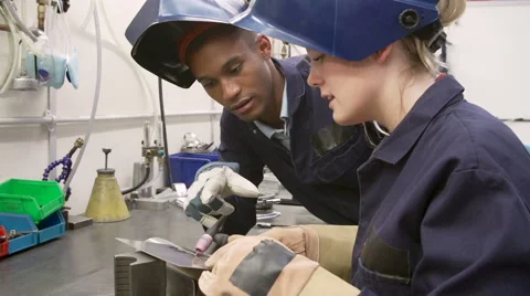 Engineer Teaching Apprentice To Use TIG Welding Machine Stock Footage 40246289