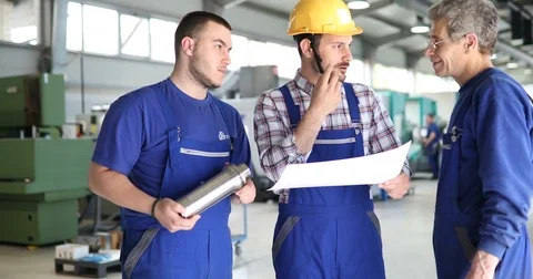 Engineer Teaching Apprentices To Use Computerized cnc metal processing machines Stock Footage 78986474