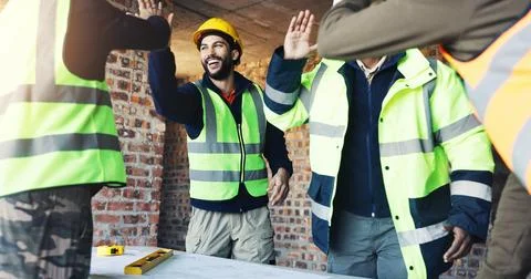Engineer, team and high five at construction site with blueprint, celebrati.. Stock Photos