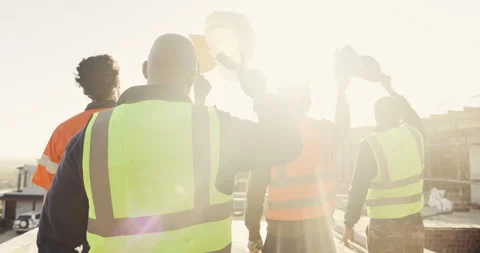 Engineer, team and raised hand with hardhat for construction, safety and ppe for Stock Footage 336780373