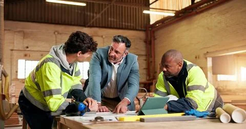 Engineer, team and supervisor with people in warehouse for carpentry report Stock Photos
