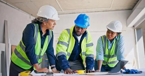 Engineer, team and talk at building site with blueprint, technician and lay.. Stock Photos