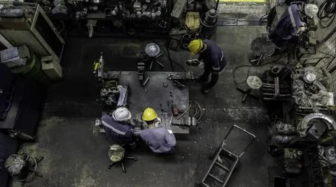 Engineer team are working in workshop room, Technician are fixing and repairi Stock Photos