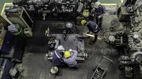 Engineer team are working in workshop room, Technician are fixing and repairi Stock Photos