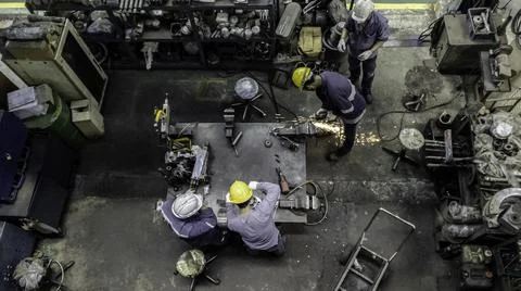 Engineer team are working in workshop room, Technician are fixing and repairi Stock Photos