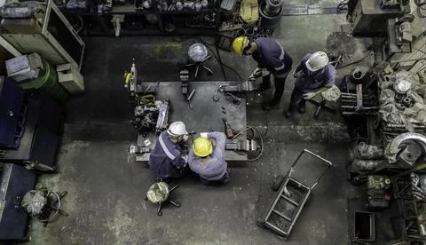 Engineer team are working in workshop room, Technician are fixing and repairi Stock Photos