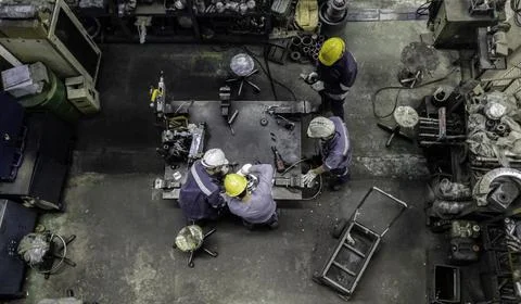 Engineer team are working in workshop room, Technician are fixing and repairi Stock Photos