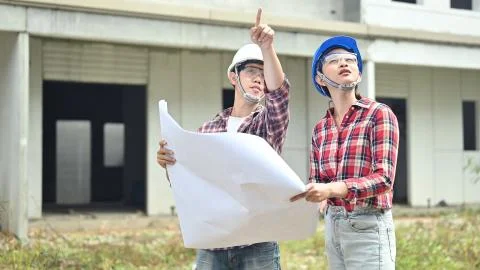 Engineer team discuss and working at construction property site.  Фото