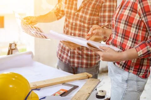 Engineer team discuss and working at construction property site. Inspection a Фото