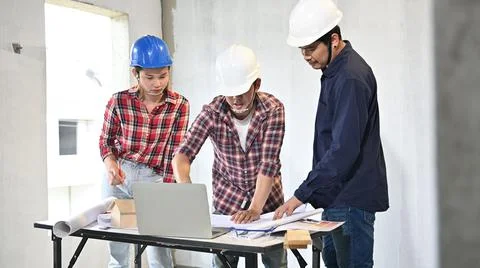 Engineer team discuss and working at construction property site. Inspection a Фото