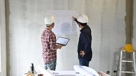 Engineer team discuss and working at construction property site. Inspection a Stock Photos