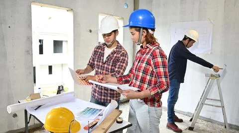 Engineer team discuss and working at construction property site. Inspection a Фото