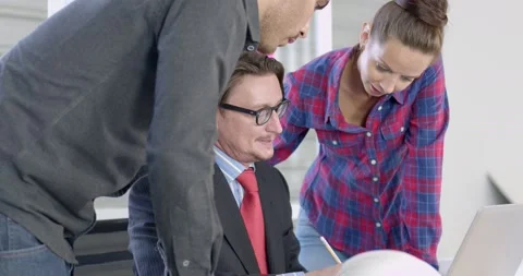 Engineer team discussing with manager or boss and working on table Stock Footage 143955985