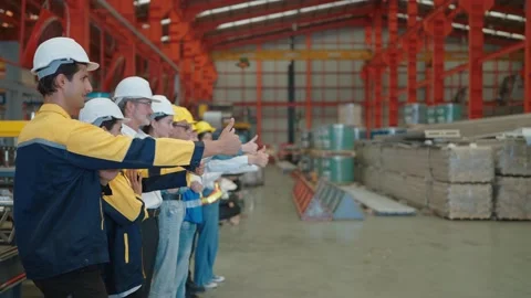 Engineer team showing thumb up in factory. Group of factory industry worker Видео 237005771