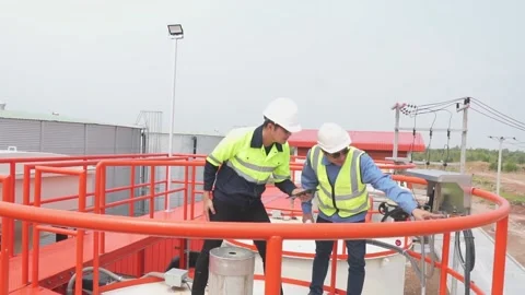 Engineer team use tablet technology to plan and monitor water systems. Video stock 238432774