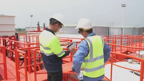 Engineer team use tablet technology to plan and monitor water systems. Stock Footage 238432836