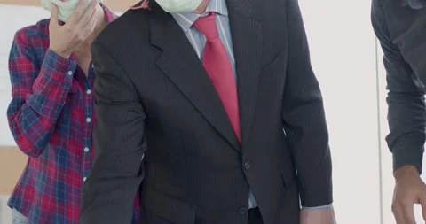 Engineer team  wearing face mask discussing with manager on table in office Stock Footage 146025991
