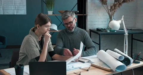 Engineer team working in office with blueprints and architect equipment Stock Footage 130354530