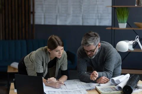 Engineer team working in office with blueprints and architect equipment Stock Photos