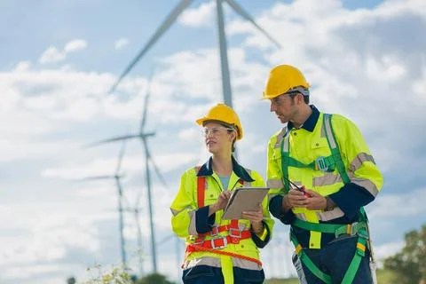 Engineer team working outdoors with safety Site survey inspection Wind turb.. Stock Photos