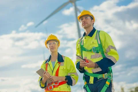 Engineer team working outdoors with safety Site survey inspection Wind turb.. Stock Photos
