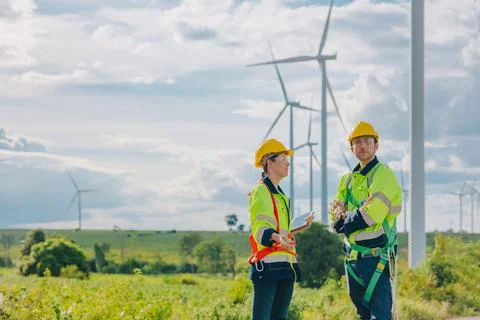 Engineer team working outdoors with safety Site survey inspection Wind turb.. Stock Photos
