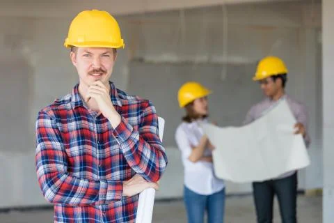 Engineer team working together in construction site. Stock Photos