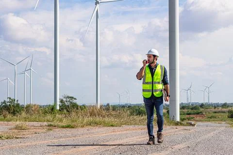 Engineer team working in wind turbine farm. Renewable energy with wind genera 스톡 사진